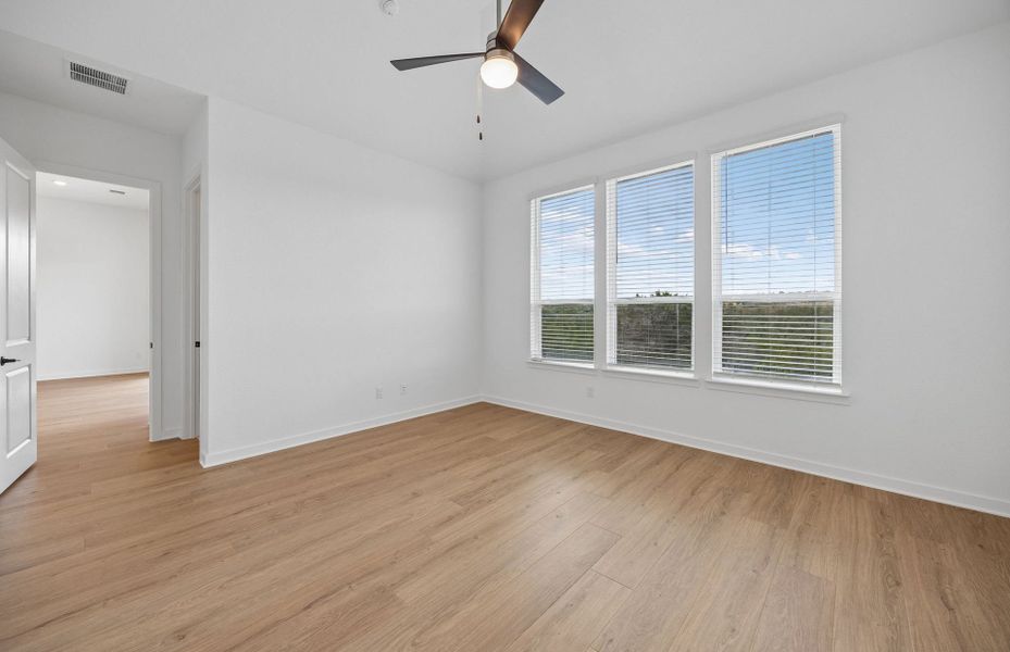 Representative unfurnished interior of a home built from the Wheeler by Pulte Homes in West Cypress Hills, Spicewood (Image 28).