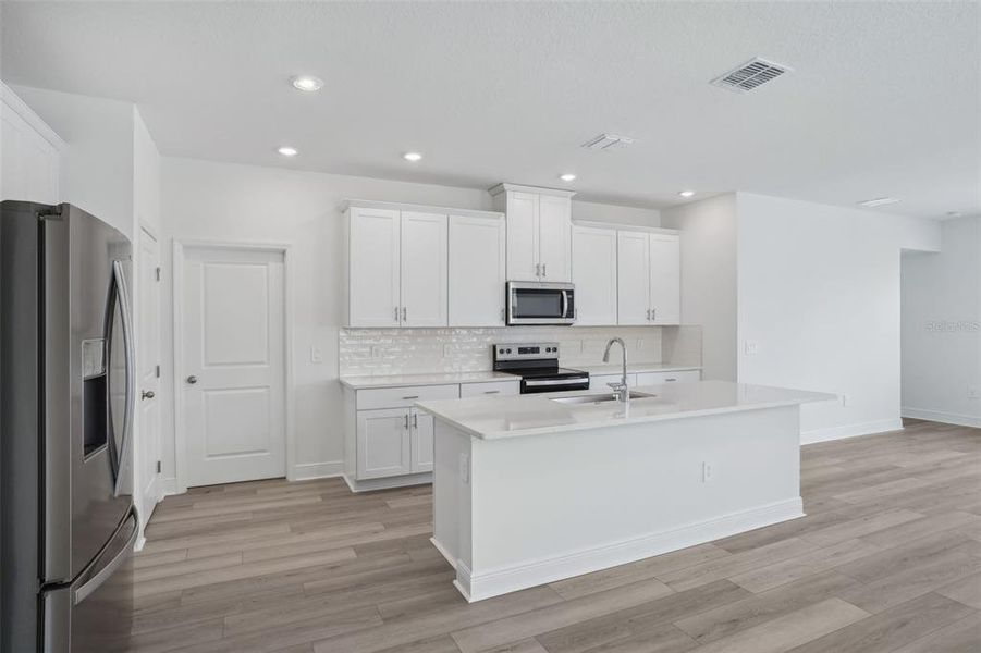 Furnished interior view inside a new home in Cyrene at Minneola - Villas, Montverde (Image 3). Furnished interior view inside a new home in Cyrene at Minneola - Villas, Montverde (Image 3).
