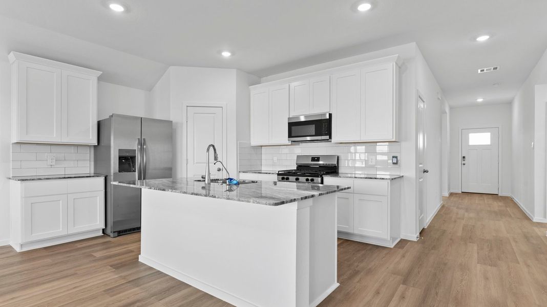 Furnished interior view inside a new home in Caldwell Crossing, Iowa Colony (Image 3).