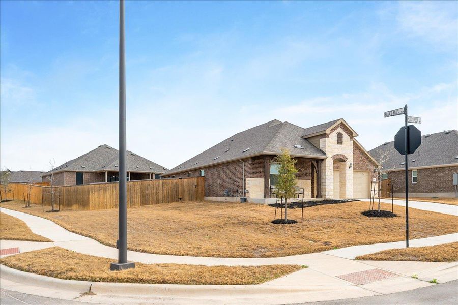 Home is on large corner lot.