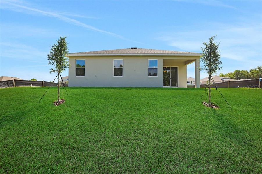 Exterior details and patio area of a home in Seaport Village, Tavares (Image 21).