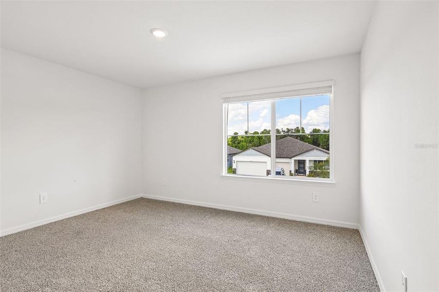 Spacious, unfurnished interior of a new home in The Grove at Stuart Crossing - Signature Series, Bartow (Image 34).