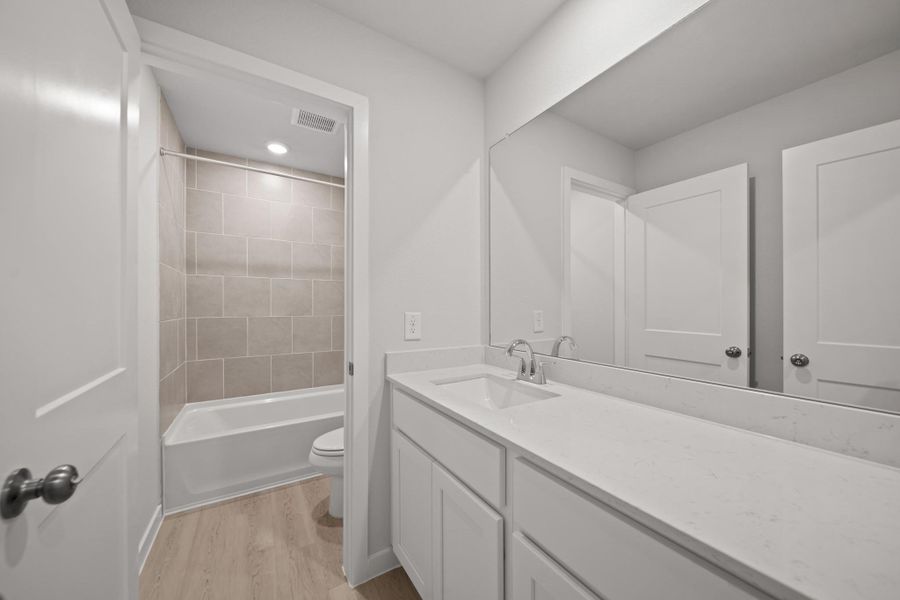 Furnished interior view inside a new home in Sunterra, Katy (Image 3).