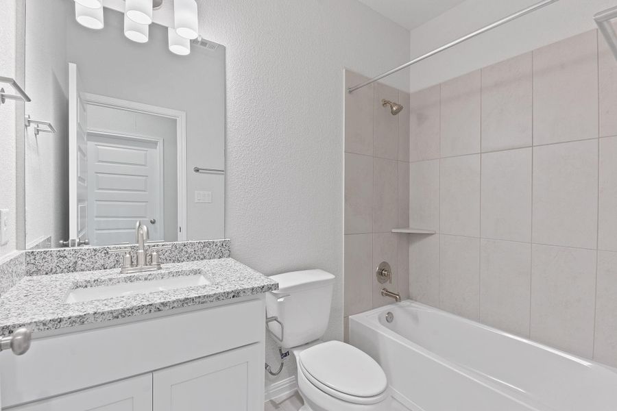 Furnished interior view inside a new home in Retreat at Hero Way, Leander (Image 7).