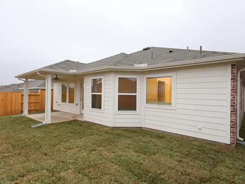 Exterior details and patio area of a home in Magnolia Ridge, Magnolia (Image 3).