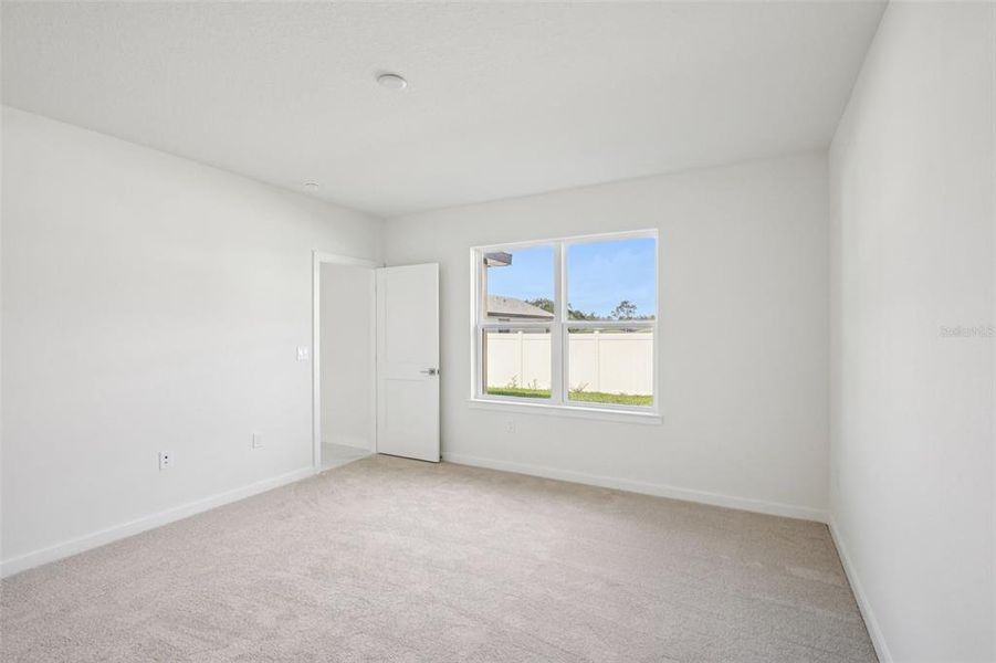 Spacious, unfurnished interior of a new home in Grasslands West, Lakeland (Image 18).