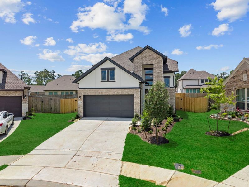 Front exterior of a new home in Escondido, Magnolia, TX, highlighting curb appeal (Image 2). Front exterior of a new home in Escondido, Magnolia, TX, highlighting curb appeal (Image 2).
