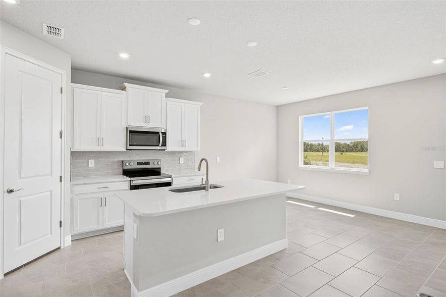 Furnished interior view inside a new home in Windwater, Parrish (Image 9).