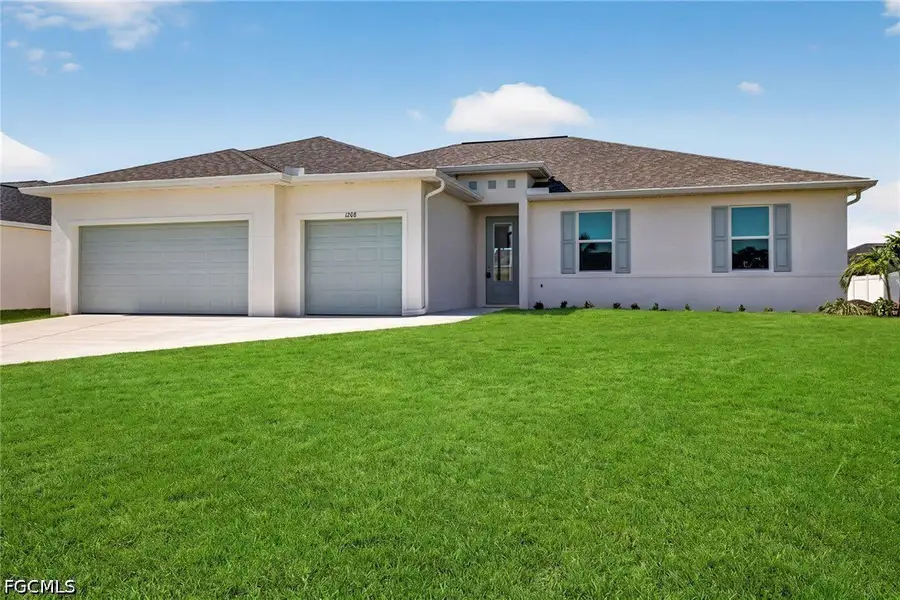 Front exterior of a new home in Cape Coral, Cape Coral, FL, highlighting curb appeal (Image 1). Front exterior of a new home in Cape Coral, Cape Coral, FL, highlighting curb appeal (Image 1).