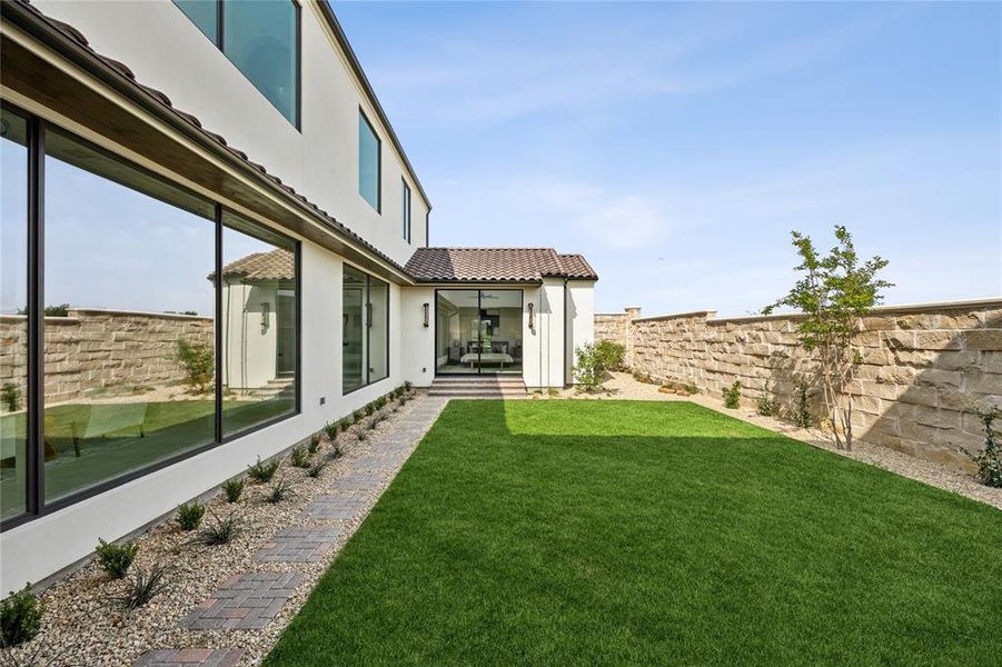 Exterior details and patio area of a home in Avadene at Las Colinas, Irving (Image 26).