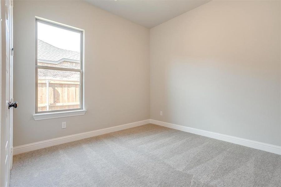 Unfurnished room with light carpet