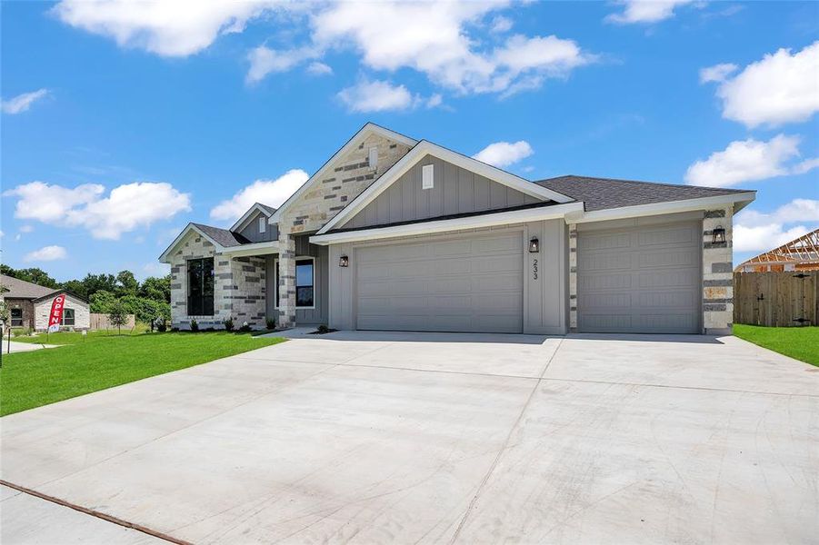 Front exterior of a new home in Rosenthal Estates, Lorena, TX, highlighting curb appeal (Image 2). Front exterior of a new home in Rosenthal Estates, Lorena, TX, highlighting curb appeal (Image 2).