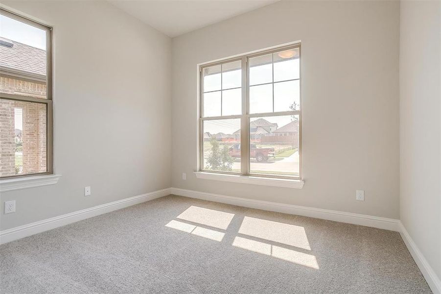 Unfurnished room with light colored carpet