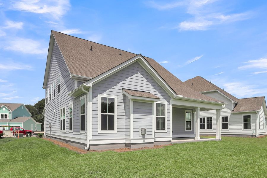 Front exterior of a new home in Tidewater at Lakes of Cane Bay, Summerville, SC, highlighting curb appeal (Image 1).