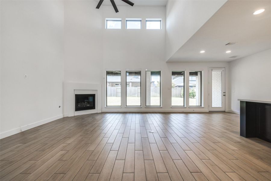 Very spacious open plan Living Room through to Kitchen and Breakfast Room, wall of windows give fabulous natural light, gas fire