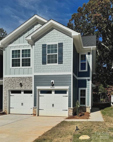 Front exterior of a new home in Pine Trace, Gastonia, NC, highlighting curb appeal (Image 2). Front exterior of a new home in Pine Trace, Gastonia, NC, highlighting curb appeal (Image 2).