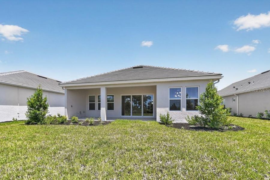 Exterior details and patio area of a home in Skye Ranch Community Group Page, Sarasota (Image 4).