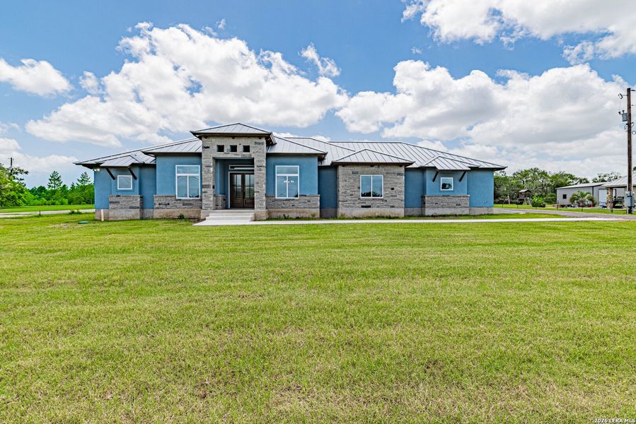 Front exterior of a new home in , Adkins, TX, highlighting curb appeal (Image 28). Front exterior of a new home in , Adkins, TX, highlighting curb appeal (Image 28).