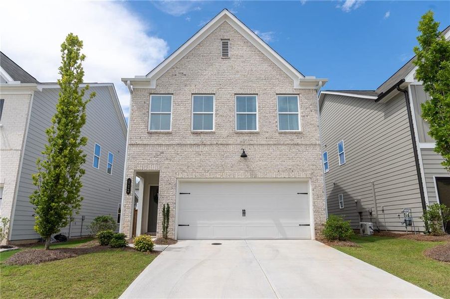 Front exterior of a new home in Winsome Park, Woodstock, GA, highlighting curb appeal (Image 1). Front exterior of a new home in Winsome Park, Woodstock, GA, highlighting curb appeal (Image 1).