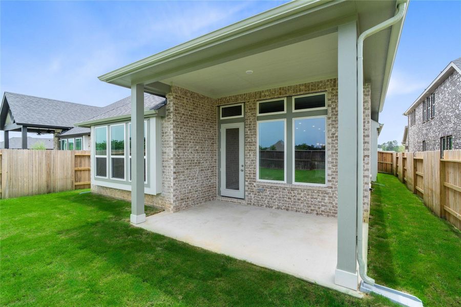 The covered patio offers a tranquil outdoor retreat, perfectly designed for savoring your quiet morning coffee or unwinding during peaceful evening relaxation.