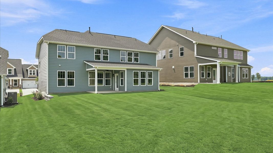 Elegant exterior with a rear covered porch—perfect for relaxing or entertaining outdoors