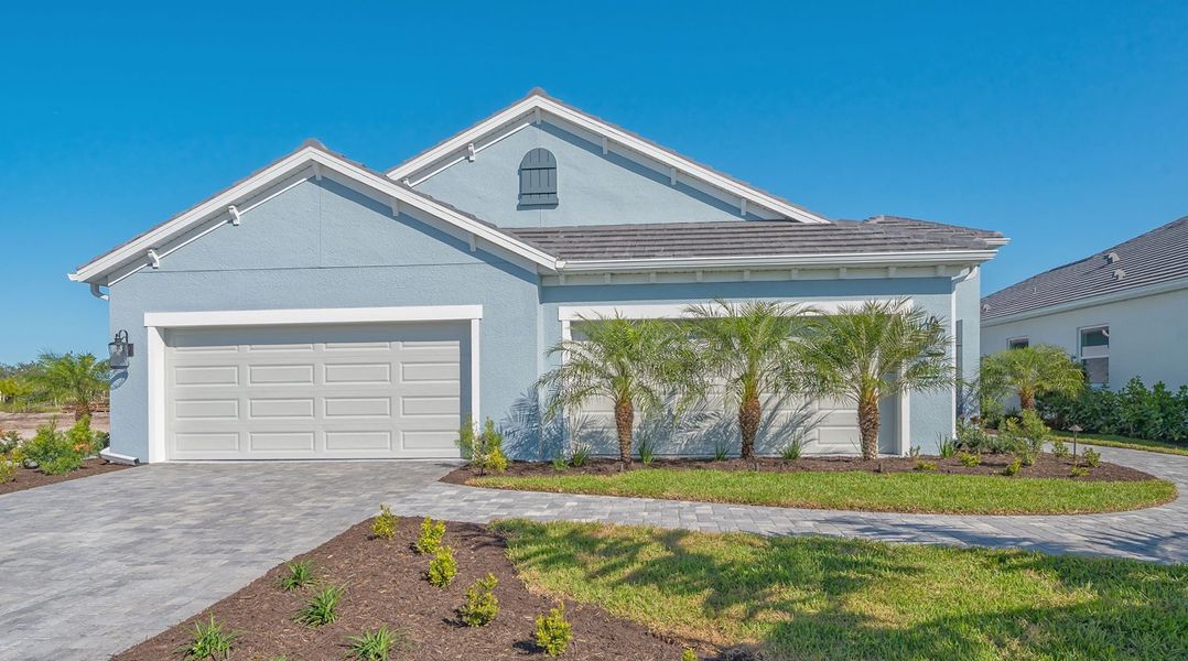 Representative exterior photo of a completed home built from the Tidewinds 2 by Neal Communities in Boca Royale Golf & Country Club at Wellen Park, Englewood, FL (Image 2).