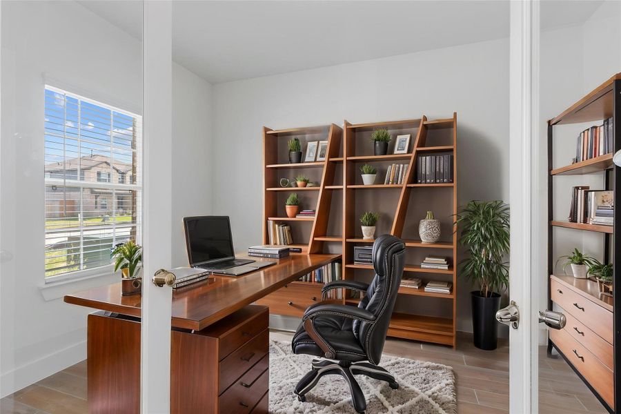 A dedicated home office with French doors and natural light—perfect for productivity or quiet retreat. Whether working from home or tackling your next big idea, this space checks all the boxes. A dedicated home office with French doors and natural light—perfect for productivity or quiet retreat. Whether working from home or tackling your next big idea, this space checks all the boxes.
