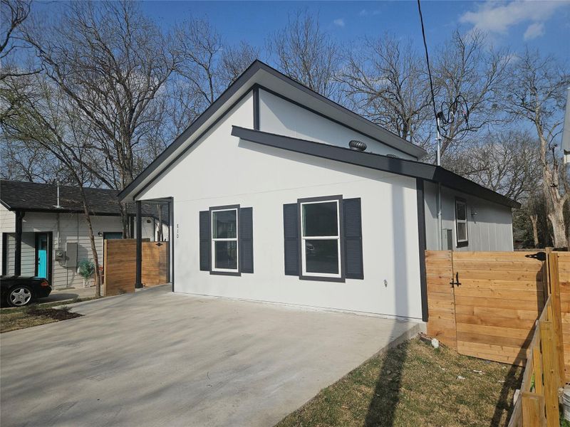 View of home's exterior featuring fence