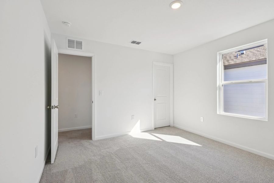 Representative unfurnished interior of a home built from the Keele by Starlight Homes in Hawks Run, Kissimmee (Image 25).