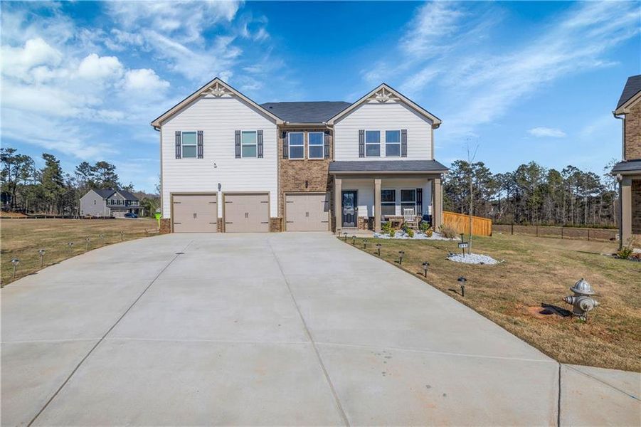 Front exterior of a new home in , McDonough, GA, highlighting curb appeal (Image 1). Front exterior of a new home in , McDonough, GA, highlighting curb appeal (Image 1).