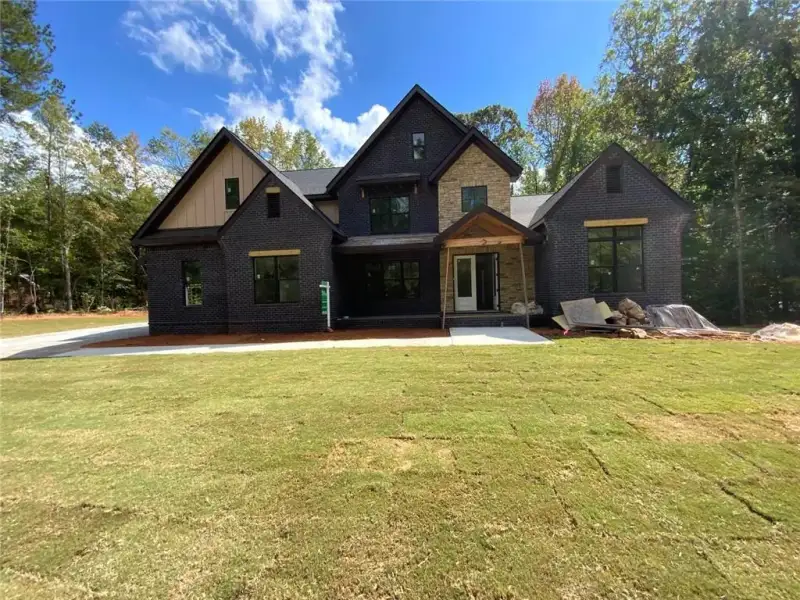 Front exterior of a new home in , Conyers, GA, highlighting curb appeal (Image 3). Front exterior of a new home in , Conyers, GA, highlighting curb appeal (Image 3).