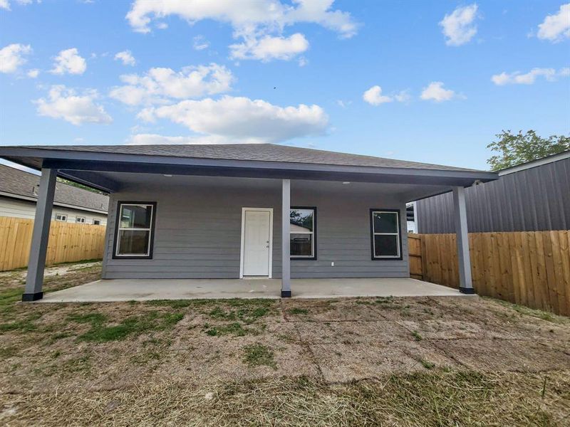 Rear view of property with a patio area and a fenced backyard Rear view of property with a patio area and a fenced backyard