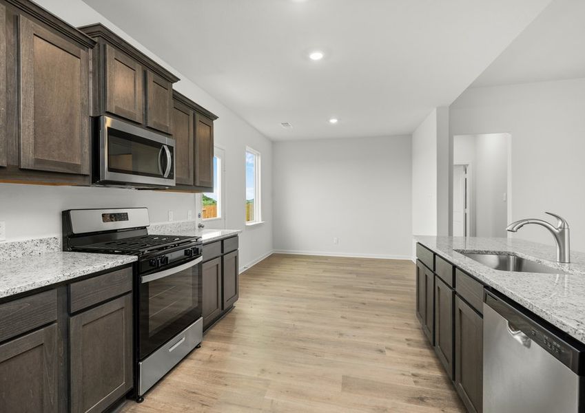 The dining room sits right off of the kitchen. The dining room sits right off of the kitchen.