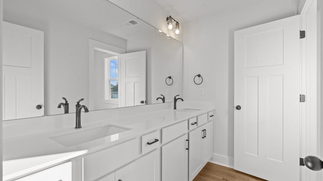 Top-notch bathroom with current fixtures, tasteful materials, and elevated charm Top-notch bathroom with current fixtures, tasteful materials, and elevated charm