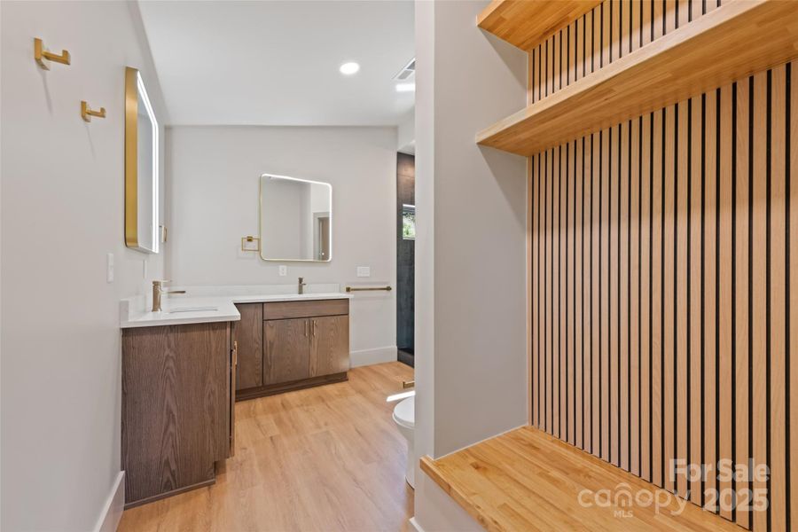 Entrance to primary bathroom provides extra space and spa-like experience