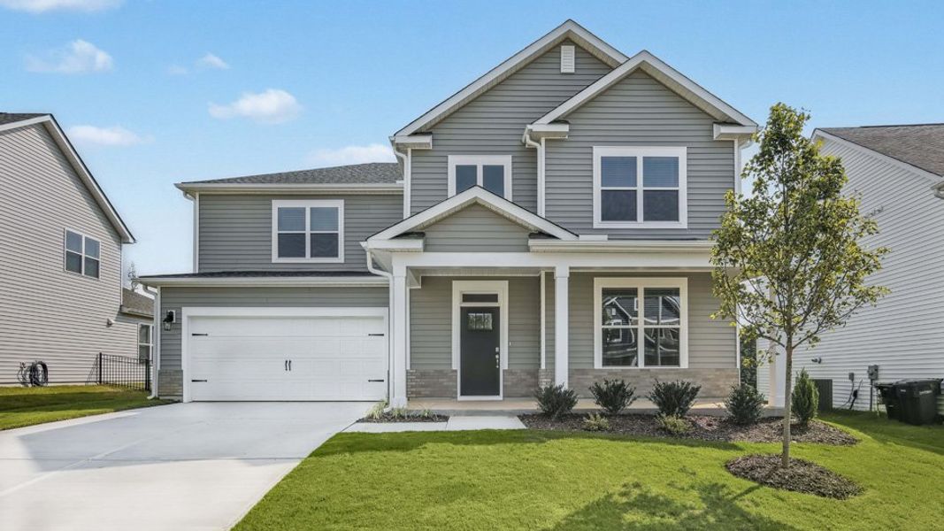 Representative exterior photo of a completed home built from the Jordan by D.R. Horton in The Manors at Galvins Ridge, Sanford, NC (Image 24).