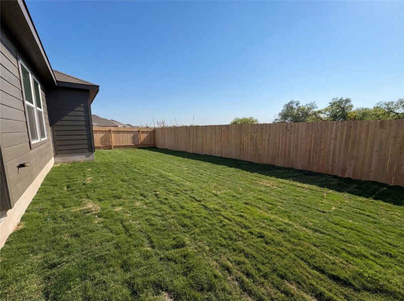 View of fenced backyard