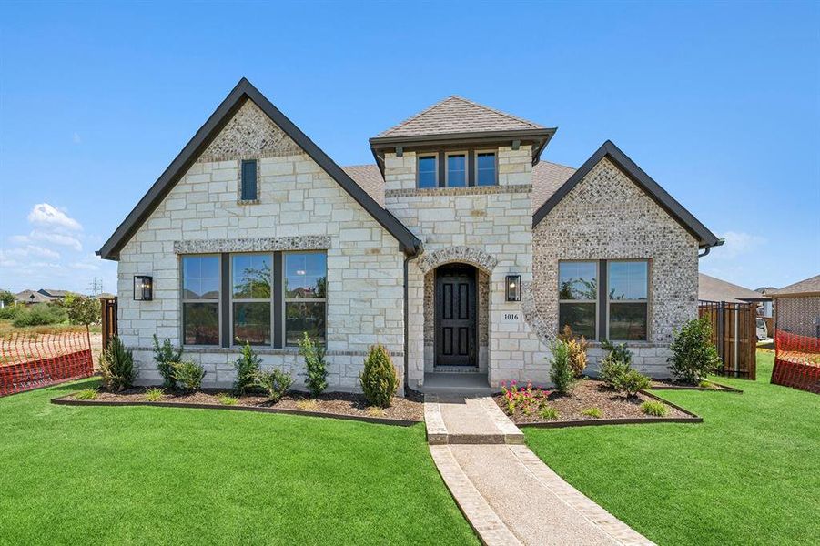 Front exterior of a new home in Karis - Village Series, Crowley, TX, highlighting curb appeal (Image 21). Front exterior of a new home in Karis - Village Series, Crowley, TX, highlighting curb appeal (Image 21).