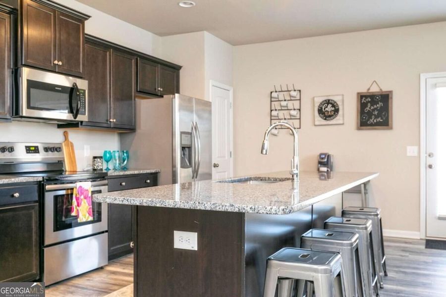 Furnished interior view inside a new home in Cobblestone Crossing Commons, Byron (Image 13).