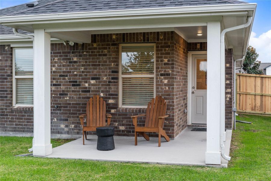 Unwind in your private outdoor oasis on this charming covered patio. Featuring durable brick exterior and a new privacy fence, this tranquil space is perfect for quiet evenings or morning coffee.