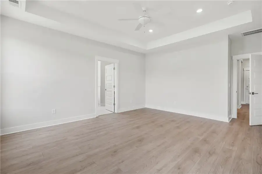 A spacious, naturally illuminated room features li A spacious, naturally illuminated room features li
