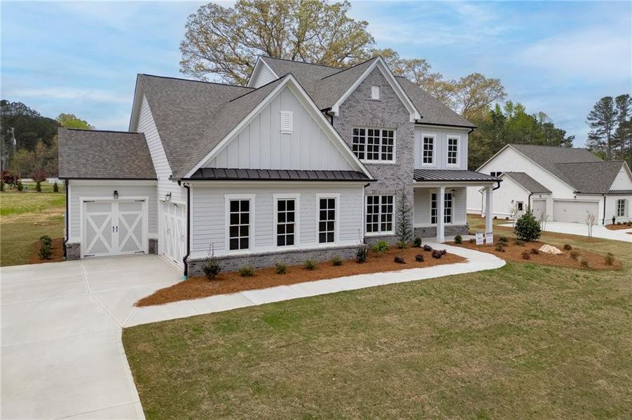 Front exterior of a new home in , Cumming, GA, highlighting curb appeal (Image 27).