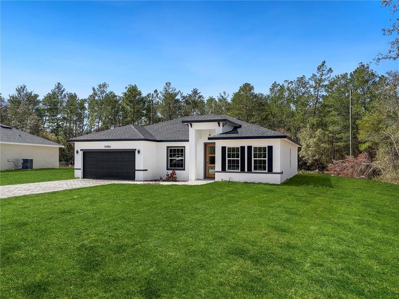 Front exterior of a new home in , Ocala, FL, highlighting curb appeal (Image 21).