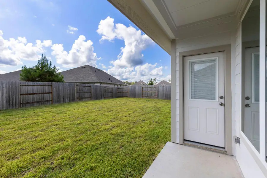 Exterior details and patio area of a home in Ladera Creek, Conroe (Image 2).