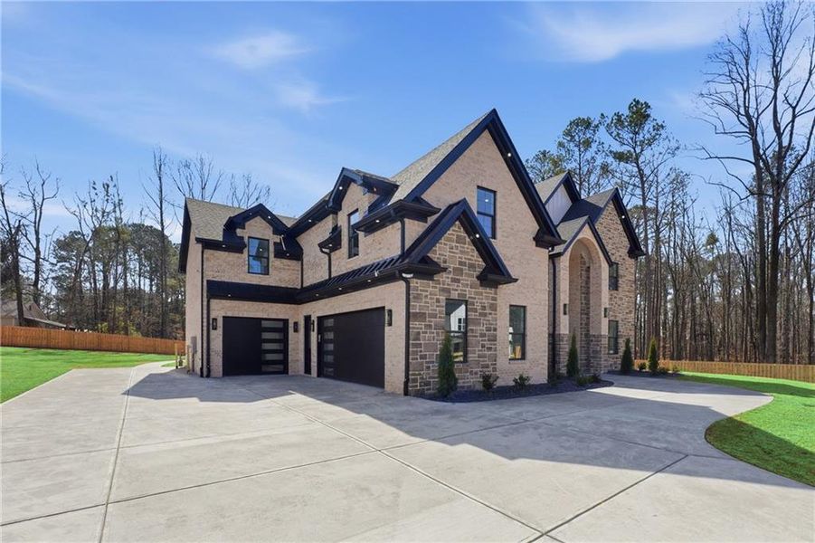 Front exterior of a new home in , Lawrenceville, GA, highlighting curb appeal (Image 24).