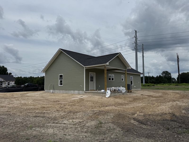 Front exterior of a new home in , St. George, SC, highlighting curb appeal (Image 1).
