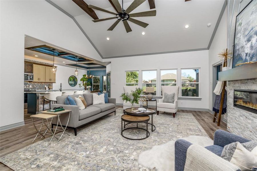 Living room features a wall of windows for lots of natural light.