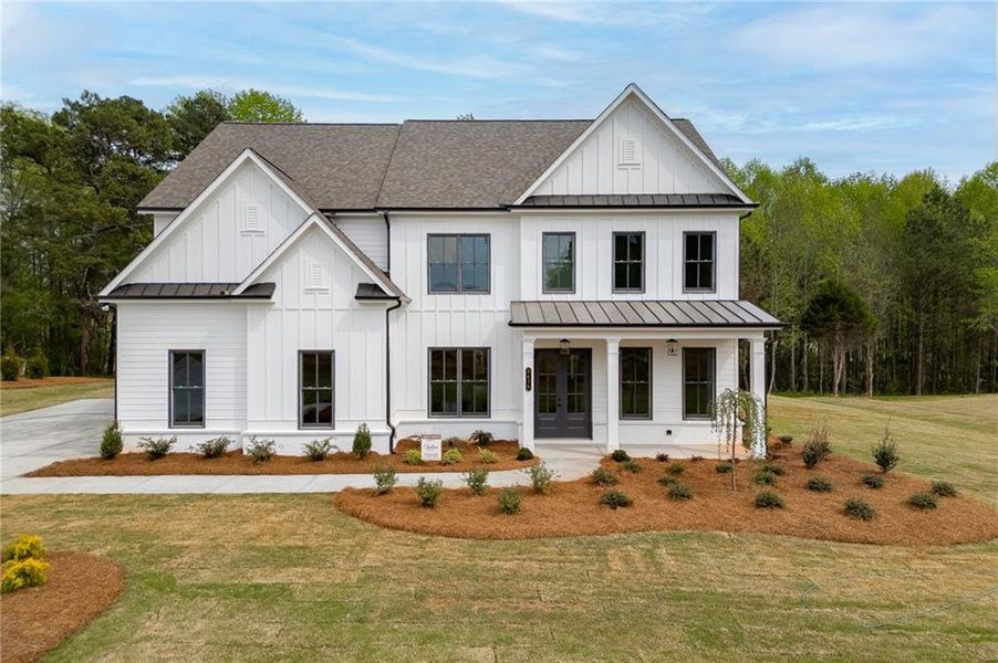 Front exterior of a new home in , Cumming, GA, highlighting curb appeal (Image 27). Front exterior of a new home in , Cumming, GA, highlighting curb appeal (Image 27).