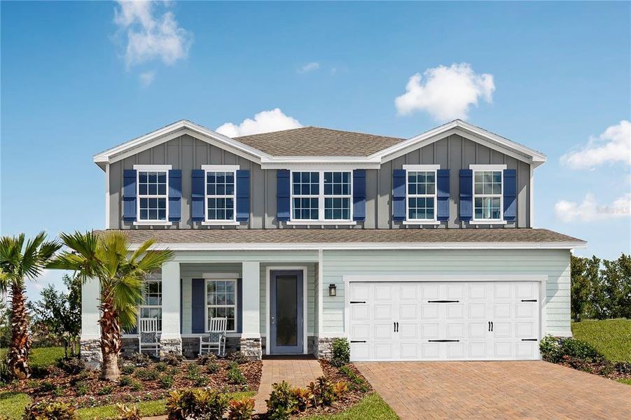 Front exterior of a new home in Ashton Covey, Winter Haven, FL, highlighting curb appeal (Image 1).