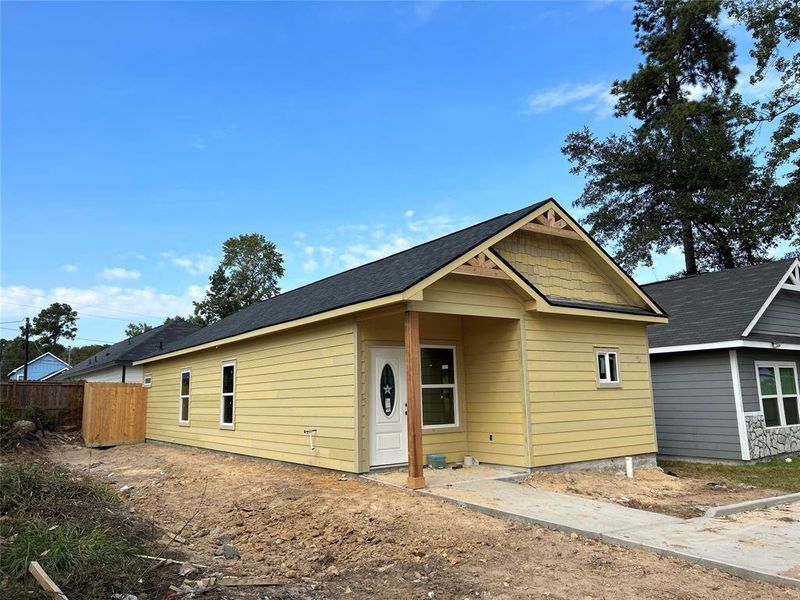 Actual house with siding. Being painted white with black trim.  Inside sheetrock this weekend.